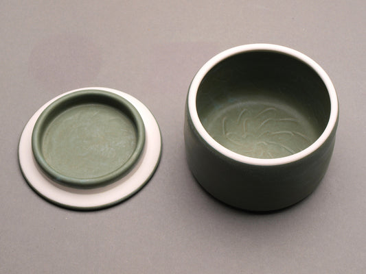 Handmade Ceramic Decorative Storage Jar with Patterned Lid. Sage Green color, Turquoise "Whirlwind" Motif Design Top.