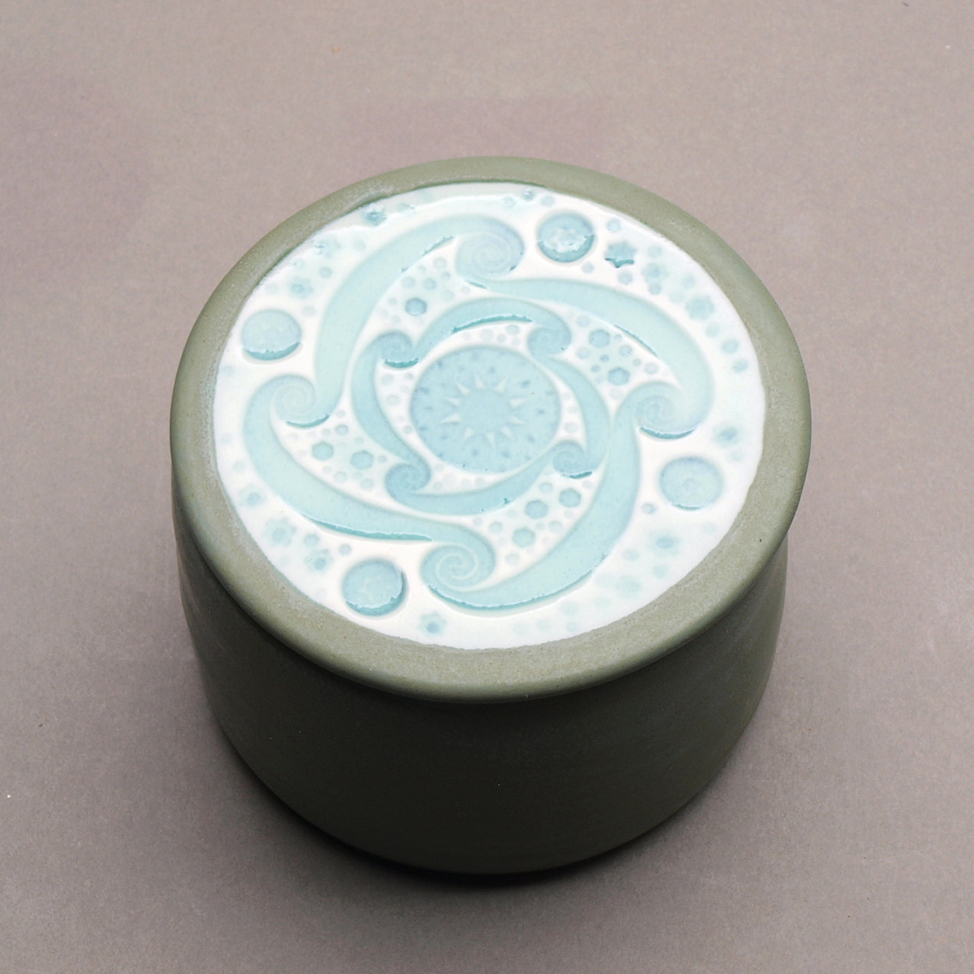 Handmade Ceramic Decorative Storage Jar with Patterned Lid. Sage Green color, Turquoise  "Whirlwind" Motif Design Top.
