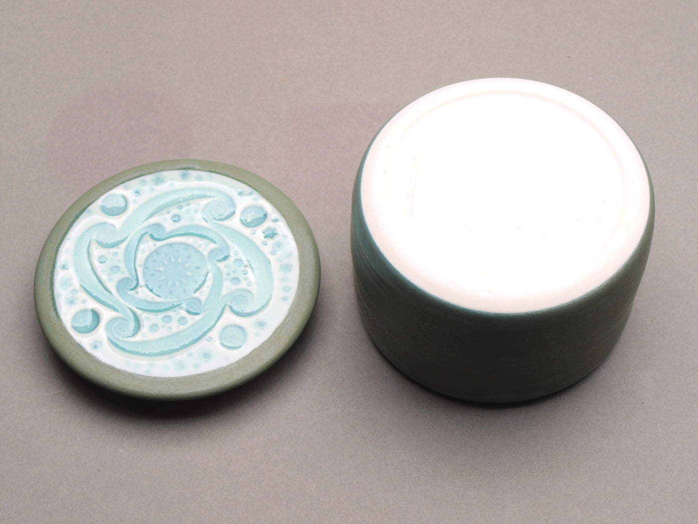 Handmade Ceramic Decorative Storage Jar with Patterned Lid. Sage Green color, Turquoise  "Whirlwind" Motif Design Top.