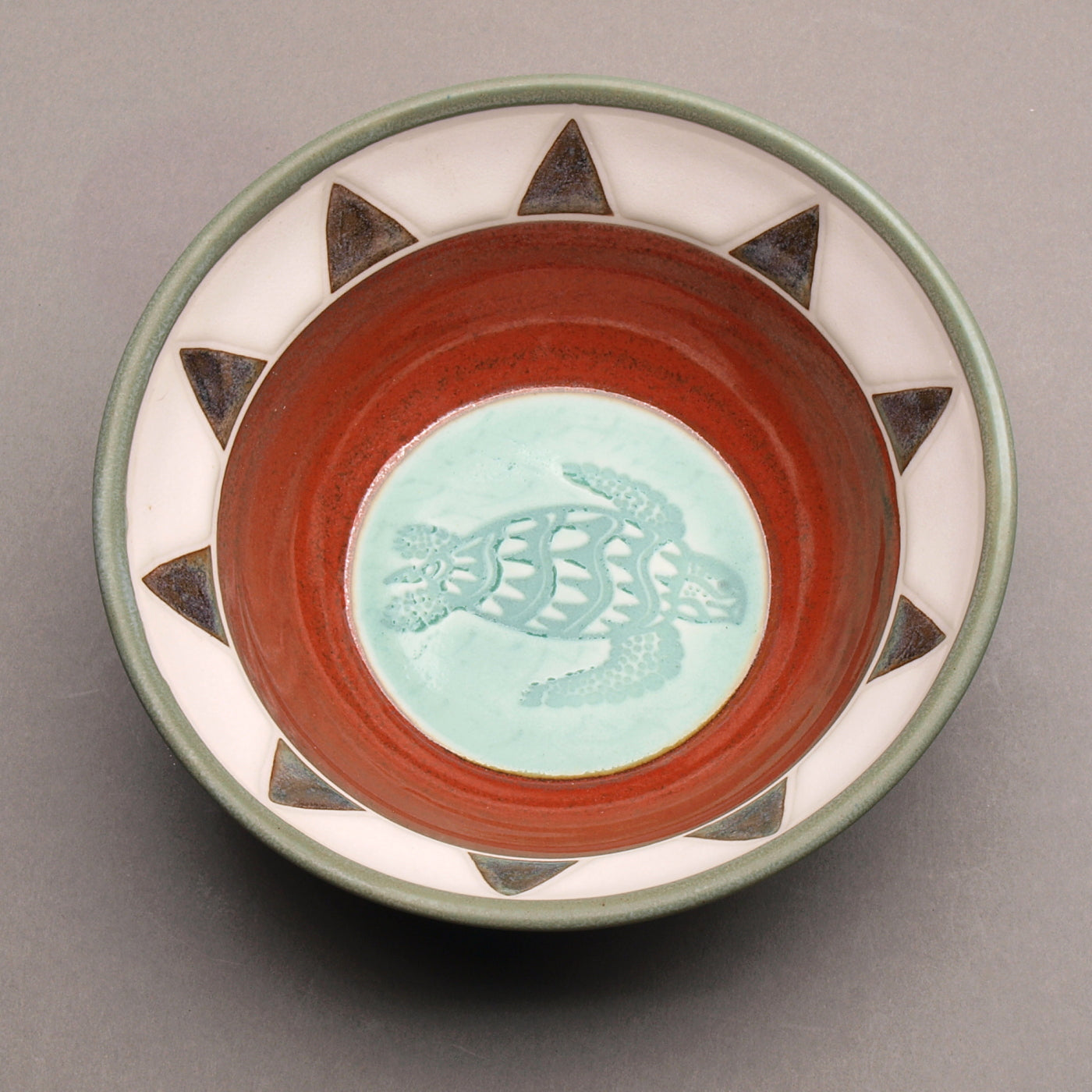 Ceramic Porcelain Pottery Handcrafted Sea Turtle Bowl, Southwestern Style Ceramic, Iron Red Ohata with Turquoise Center, Sage green exterior. Tribal Triangle Border, 8-Point Sun Design